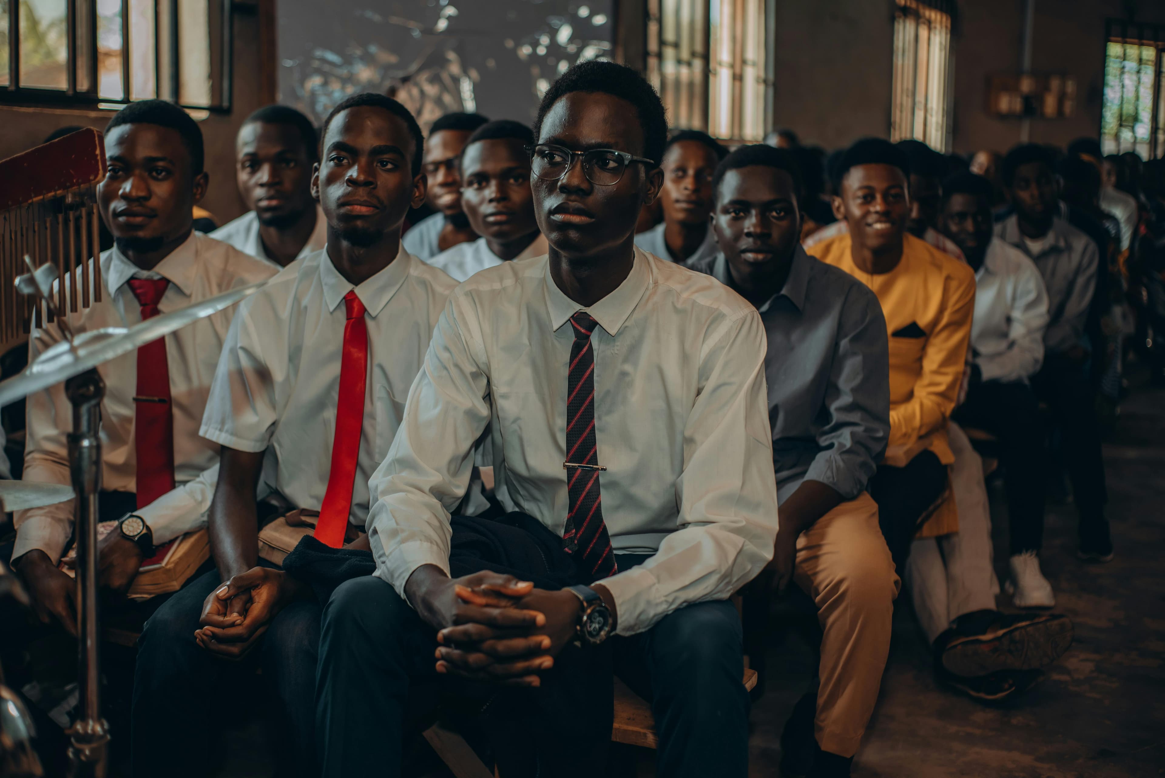 Diverse group of young students reading and learning together
